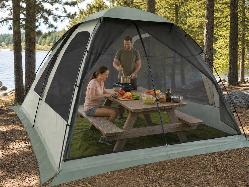 Large screen tent with rain flaps set up over a picnic table at a campsite